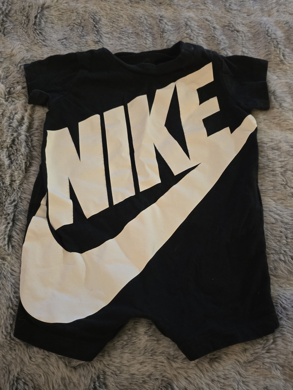 Nike Black One-Piece with White Swoosh Logo